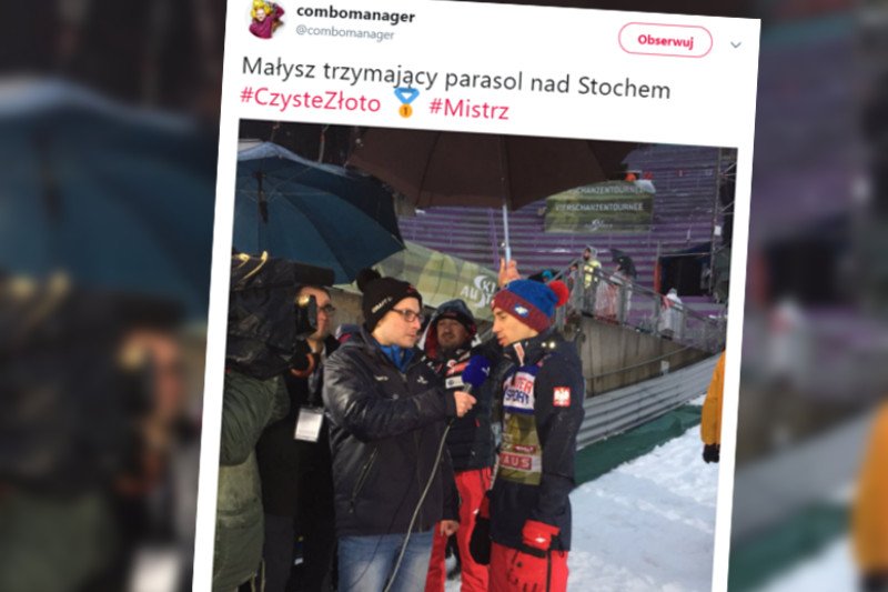 Adam Małysz trzyma parasol nad głową Kamila Stocha.